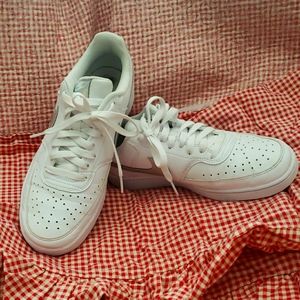 Womens Nike Court Vision low. Lightly wore Iridescent logo.